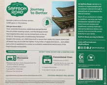 Load image into Gallery viewer, Back of Saffron Road Korean-Style Fire-Roasted Chicken package with product info, cooking instructions, and company mission. Includes certification logos.
